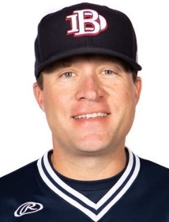 A person wearing a hat posing for the camera Description automatically generated